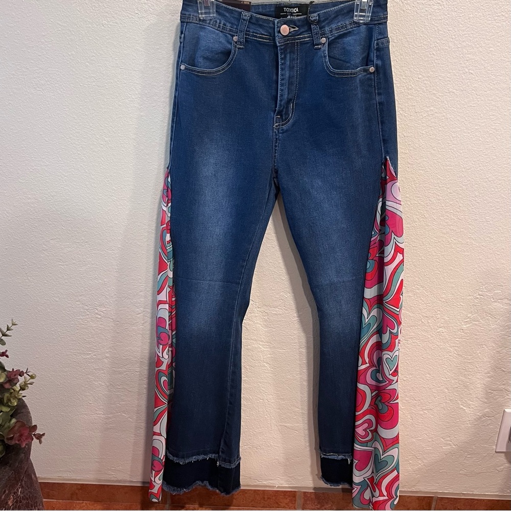 Denim Texas Flare Blue Jeans with heart prints on the sides. Size: 7 Dark Blue